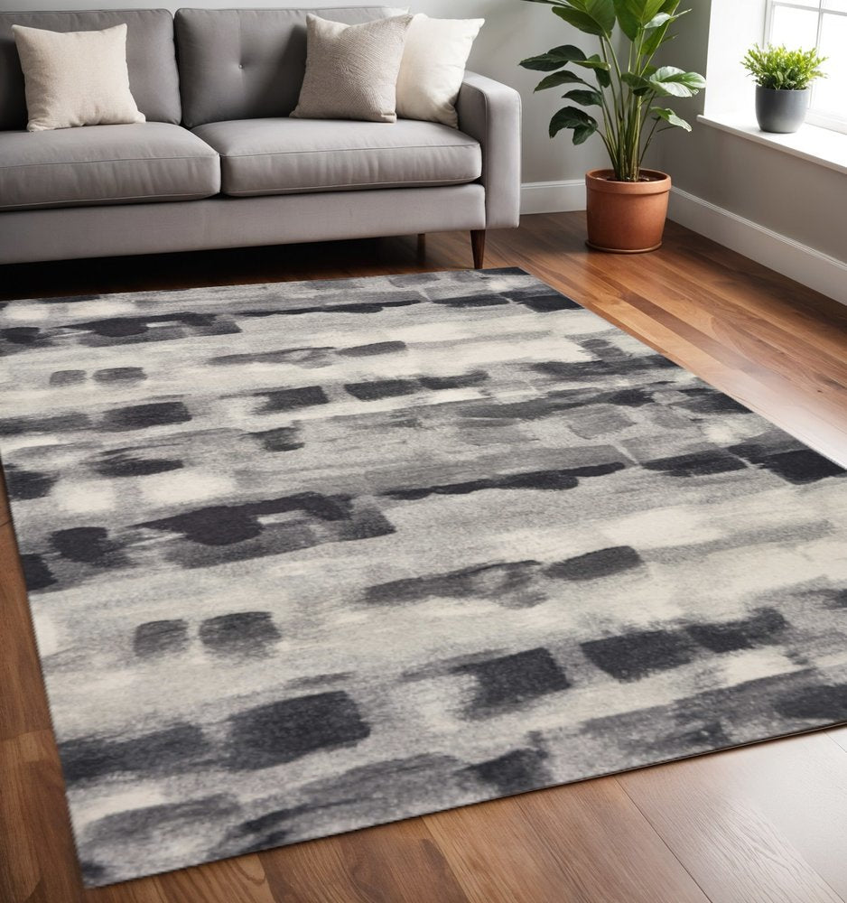 5' X 8' Gray Black And Ivory Abstract Area Rug