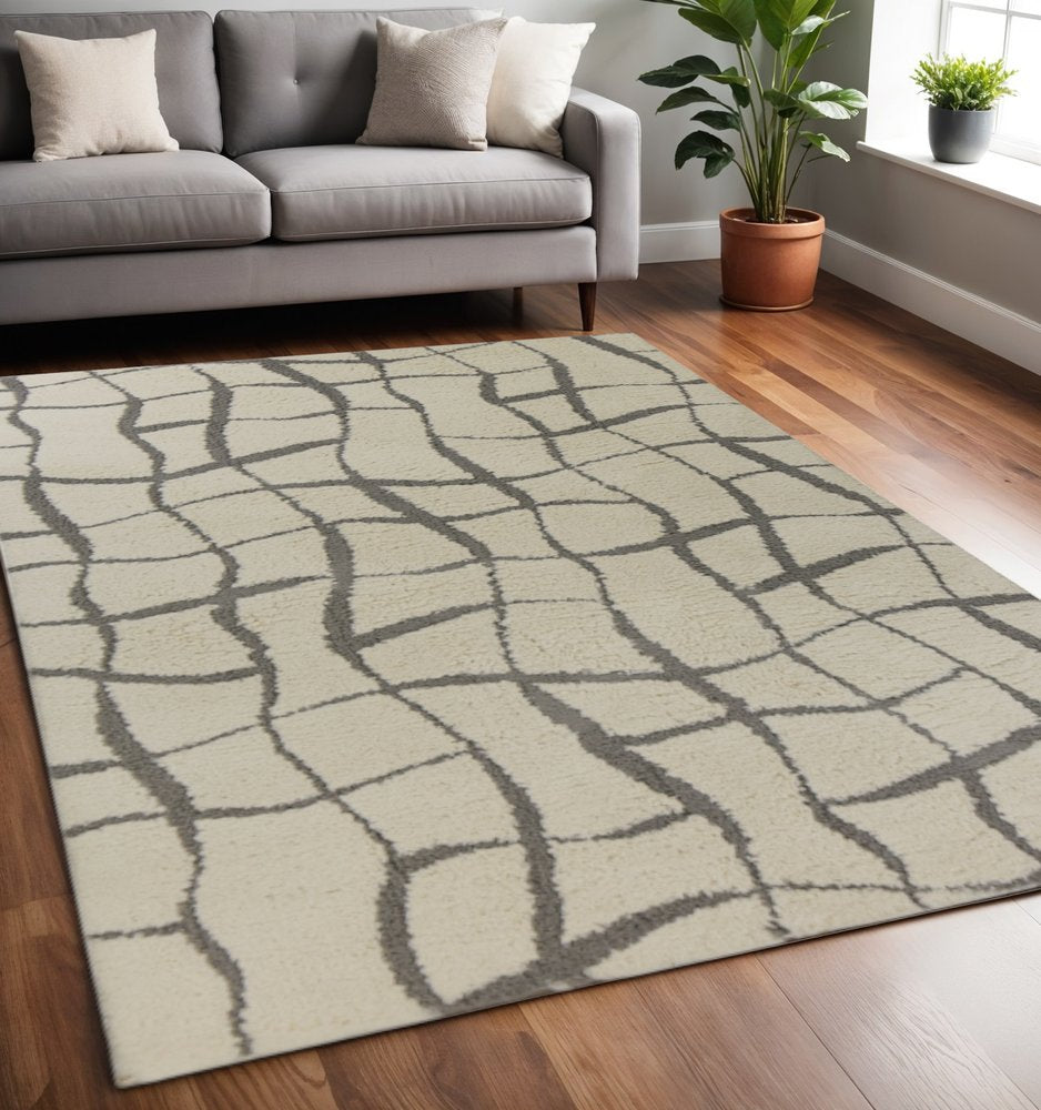 3' X 5' Ivory And Dark Gray Abstract Shag Area Rug