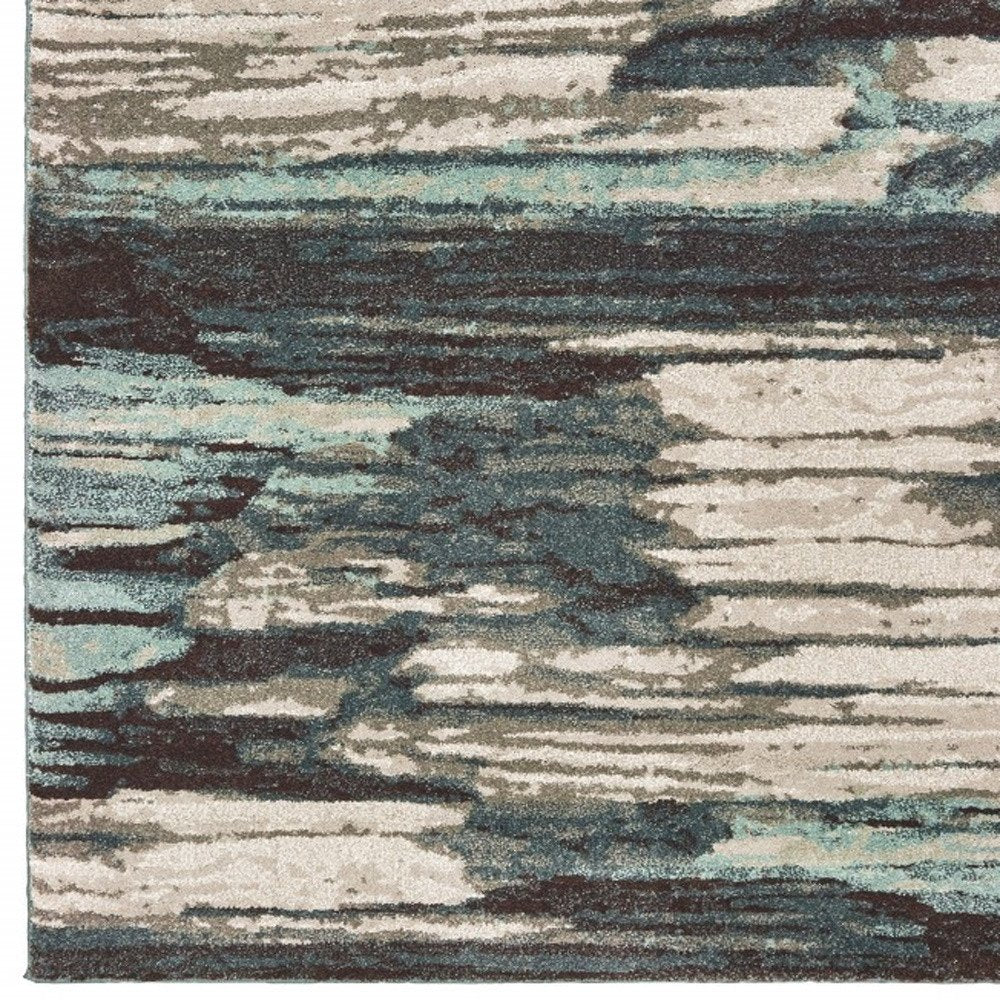 7' X 10' Ivory Blue And Gray Abstract Area Rug