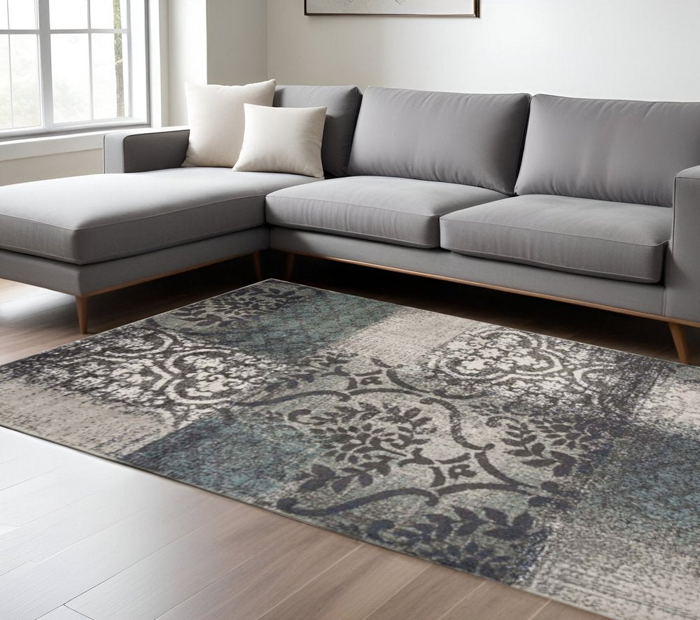 7' X 9' Teal And Ivory Damask Distressed Area Rug