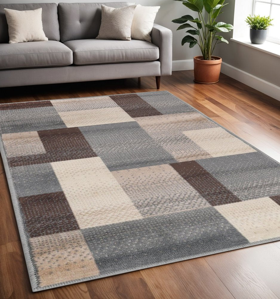 5' X 8' Gray Tan And Brown Patchwork Area Rug