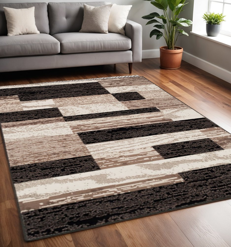 5' X 8' Black Brown And Beige Patchwork Area Rug