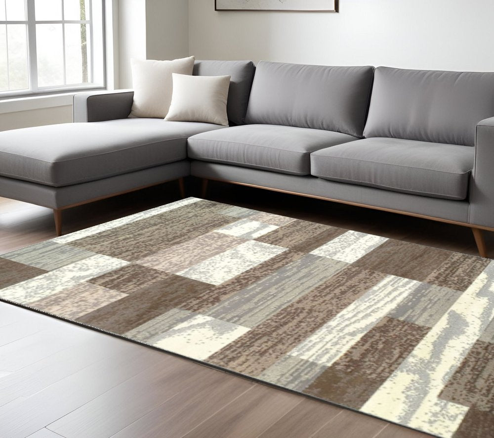 7' X 9' Blue And Ivory Patchwork Area Rug