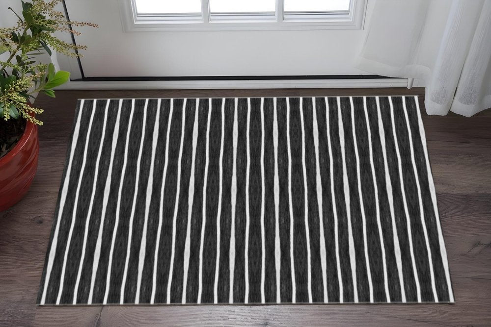 2' X 5' Black And White Modern Stripe Printed Vinyl Area Rug with UV Protection