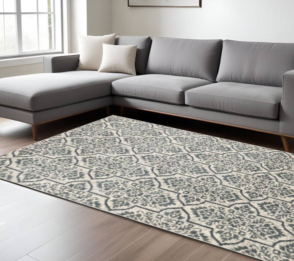 10' X 13' Ivory Blue And Sage Floral Power Loom Stain Resistant Area Rug