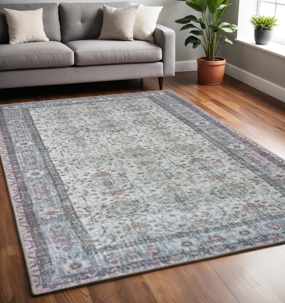 5' X 8' Ivory And Blue Oriental Power Loom Stain Resistant Area Rug