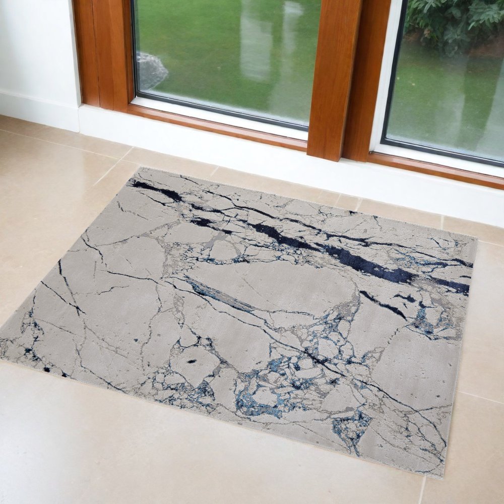 2' X 3' Ivory and Blue Marble Power Loom Distressed Area Rug