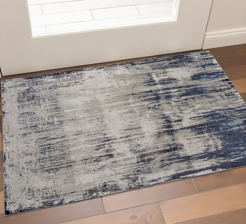 2' X 3' Tan And Blue Abstract Distressed Area Rug