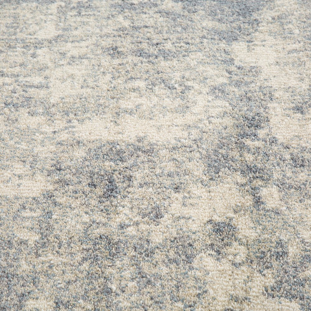 6' X 9' Light Gray Blue And Ivory Abstract Area Rug