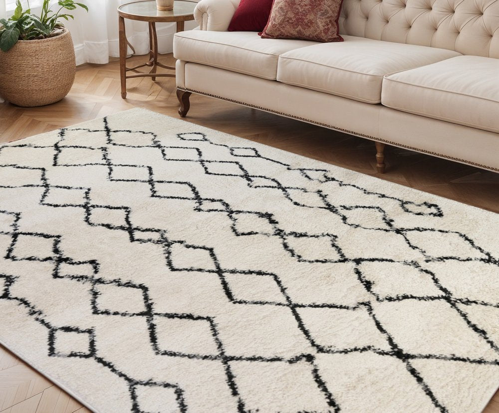 5' X 8' Ivory And Black Geometric Shag Area Rug