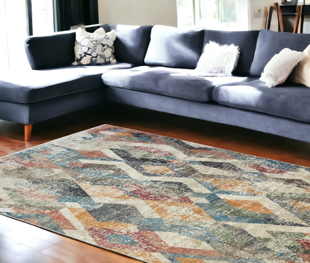 9' X 13' Beige Blue and Gray Geometric Distressed Area Rug With Fringe