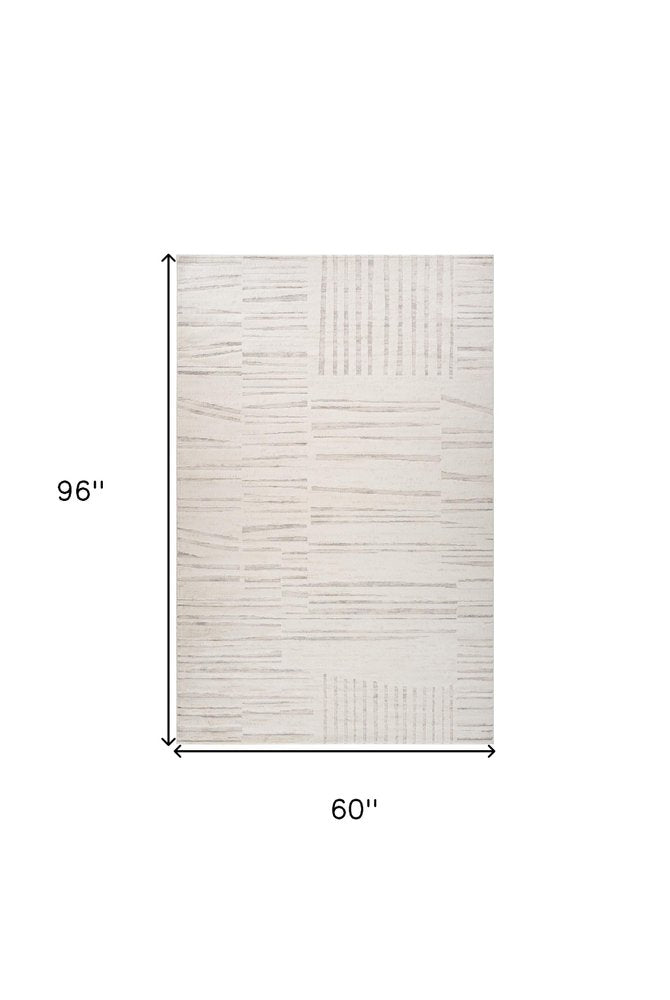 5' X 8' Gray and Beige Geometric Distressed Area Rug