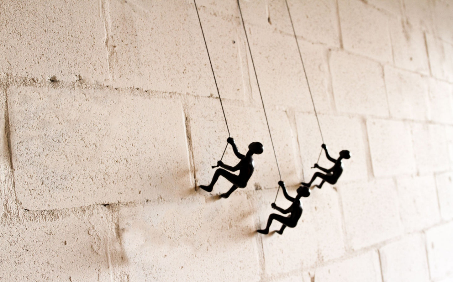 Set of Three Black Resin Climbing Man Hanging Dimensional Sculpture