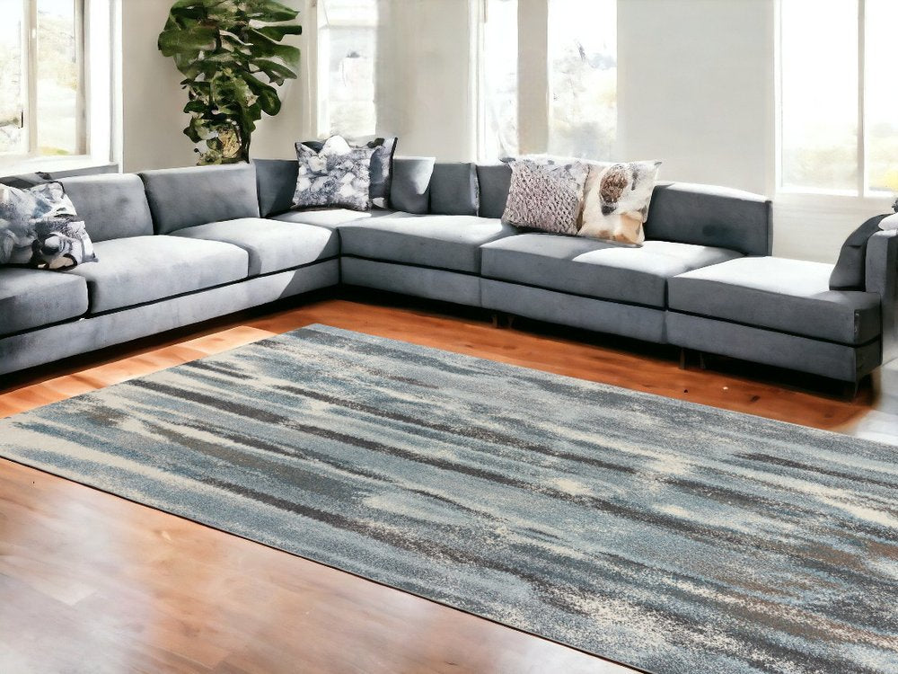 9' X 13' Teal Blue And White Abstract Area Rug