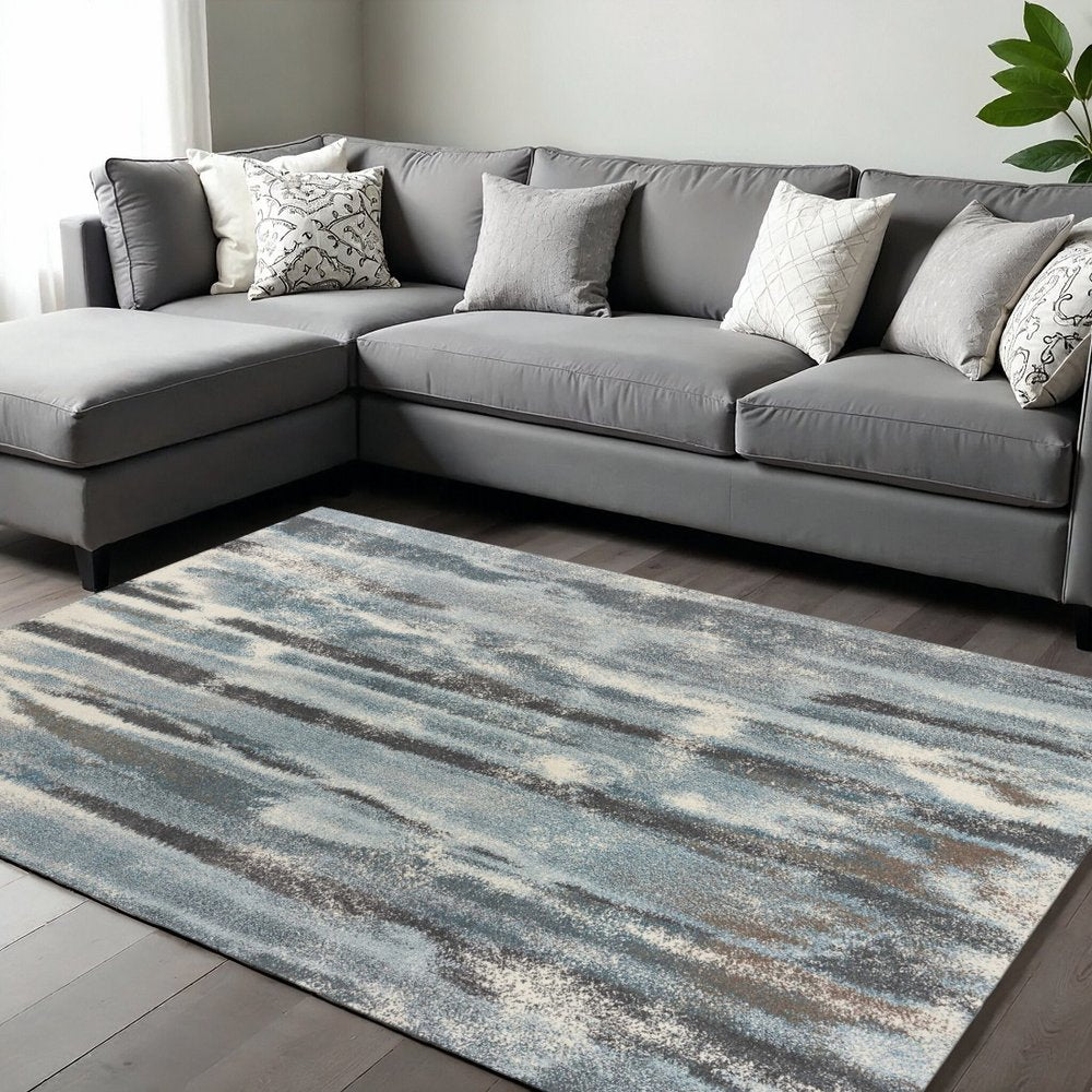 9' X 13' Teal Blue And White Abstract Area Rug