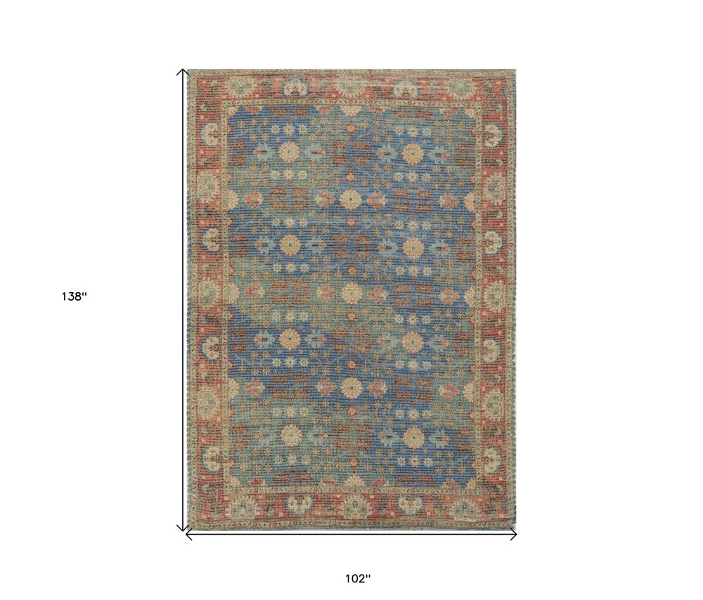 5' X 7' Blue Red And Beige Floral Medallion Hand Woven Distressed Area Rug