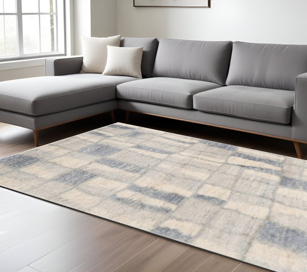 4' X 6' Ivory And Blue Abstract Geometric Distressed Area Rug