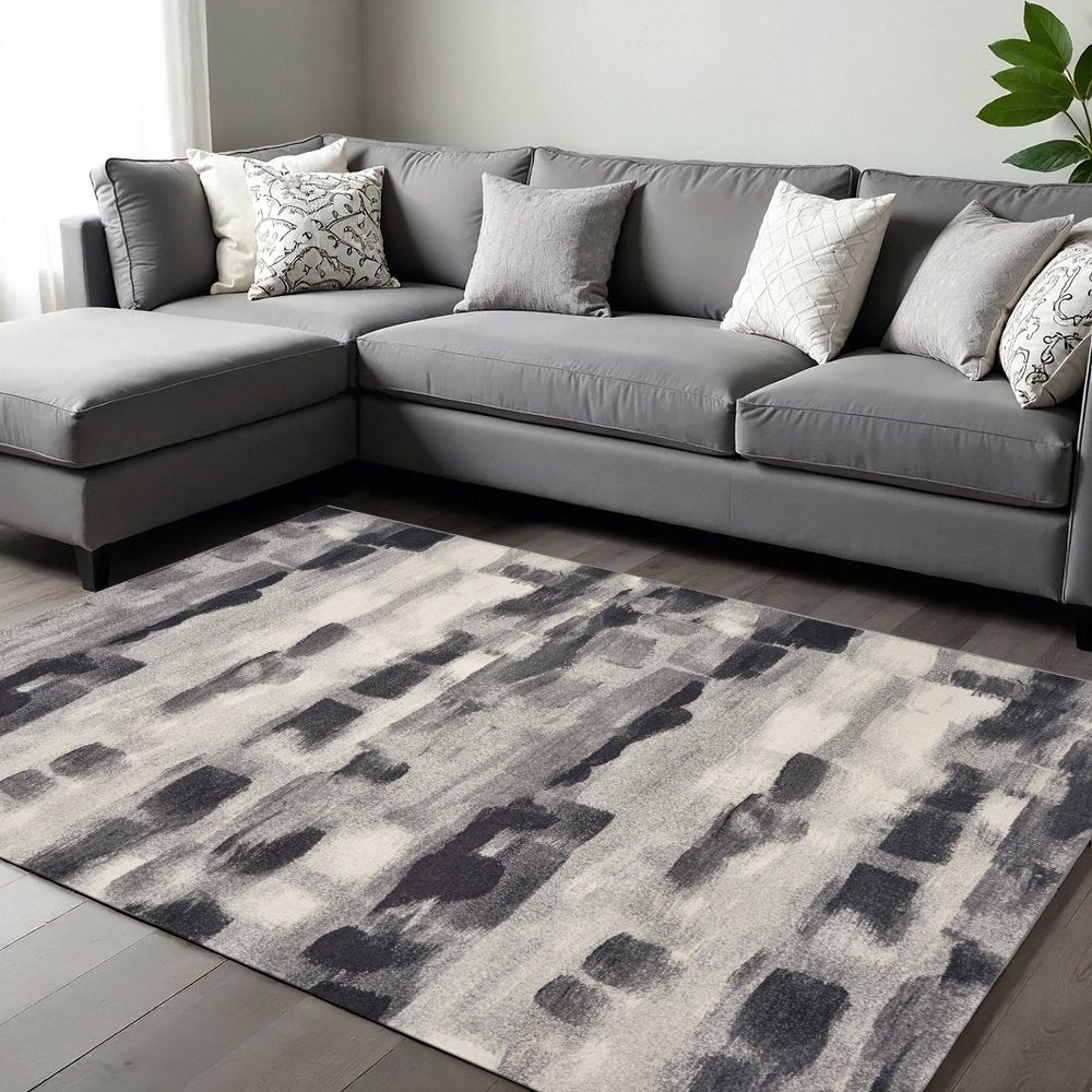 5' X 8' Gray Black And Ivory Abstract Area Rug