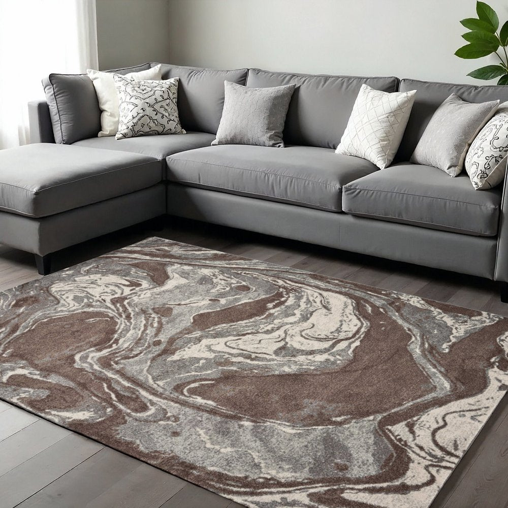 7' X 10' Brown And Ivory Abstract Area Rug