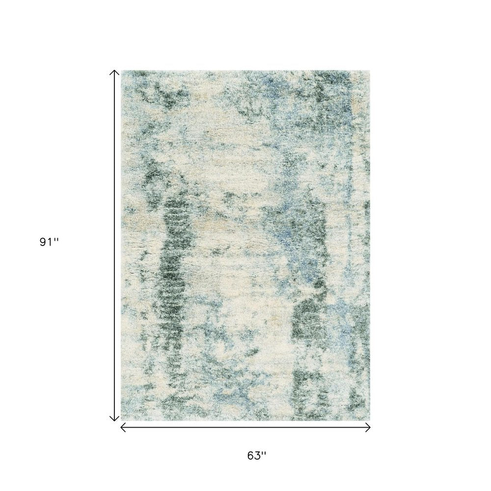 5' X 8' Ivory And Blue Abstract Area Rug
