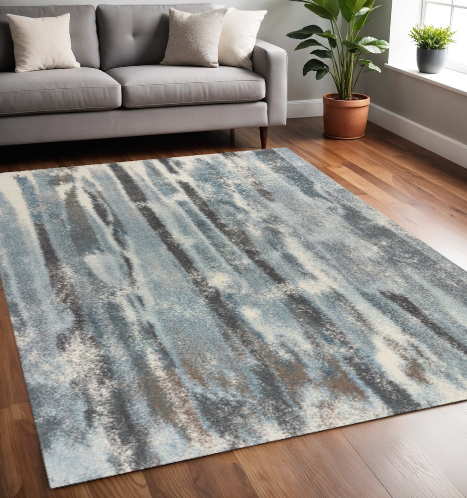 9' X 13' Teal Blue And White Abstract Area Rug