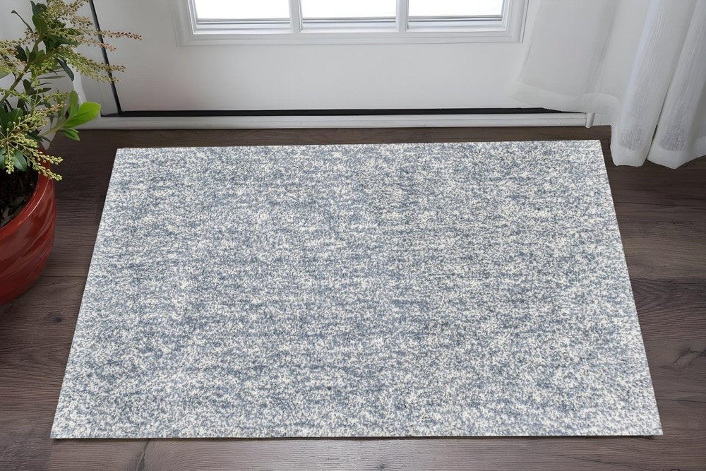 5' X 7' Slate Blue And Ivory Abstract Shag Hand Woven Area Rug