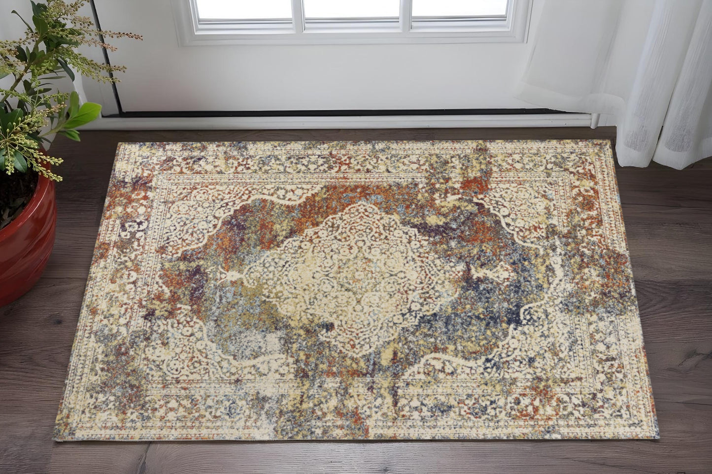 5' X 8' Ivory Blue And Orange Medallion Area Rug