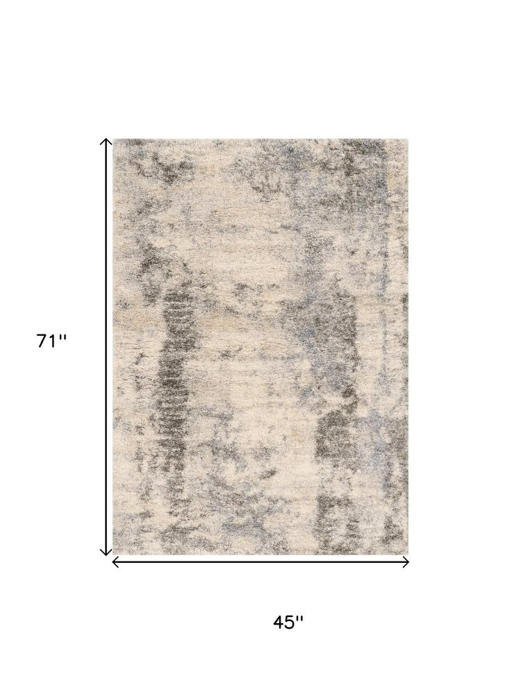 5' X 8' Ivory And Blue Abstract Area Rug