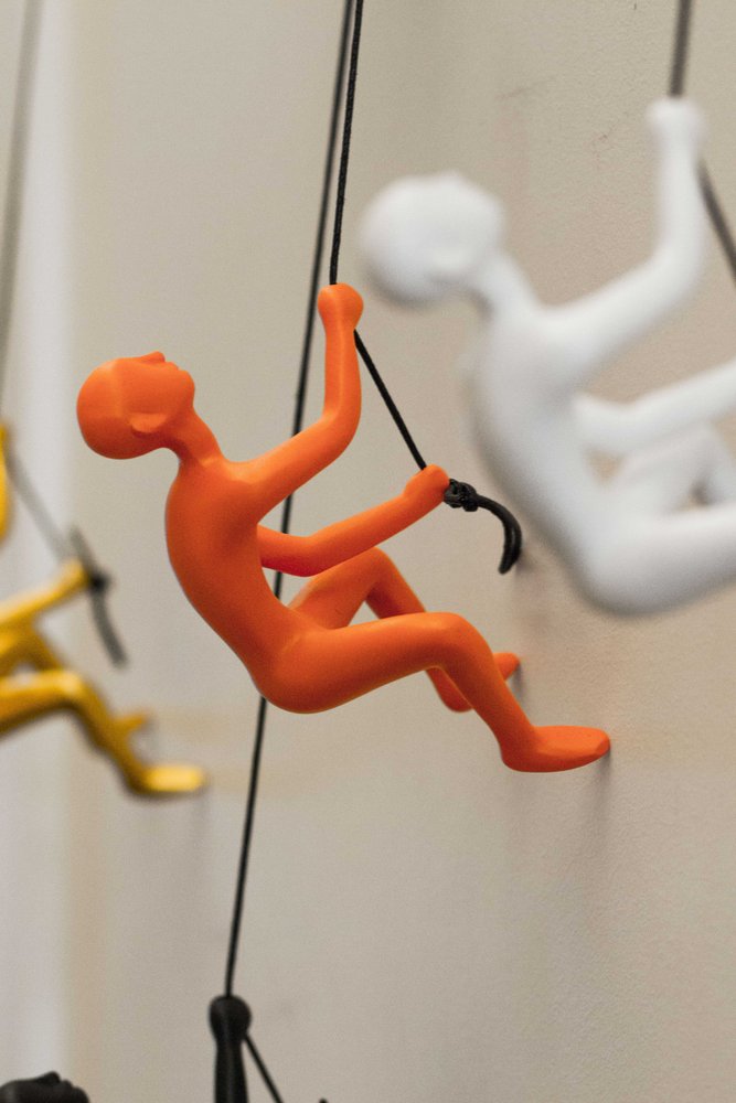 6" X 3" Orange Resin Climbing Man Hanging Dimensional Sculpture