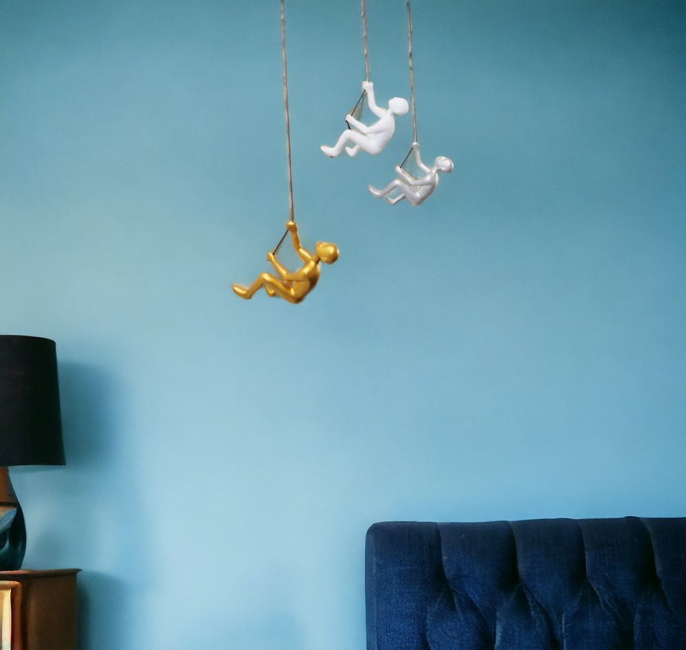 Set of Three Gold Silver And White Resin Climbing Man Hanging Dimensional Sculpture