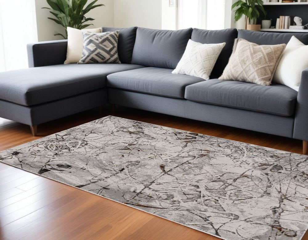 5' X 8' Ivory Gray And Brown Abstract Area Rug