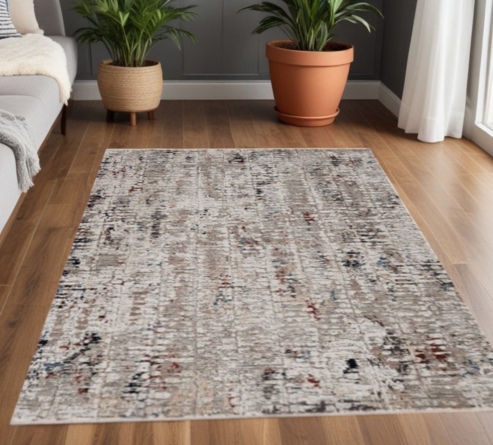 5' X 8' Beige And Gray Abstract Distressed Area Rug