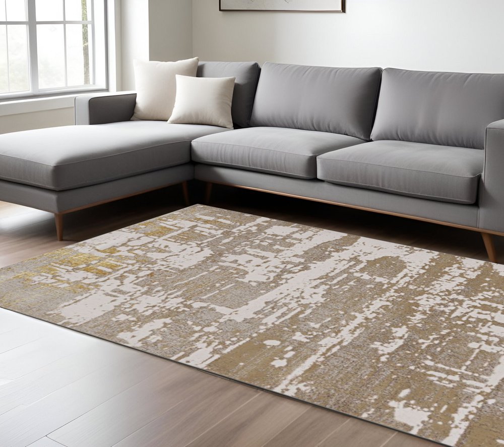 8' X 11' Ivory Taupe And Gold Abstract Area Rug