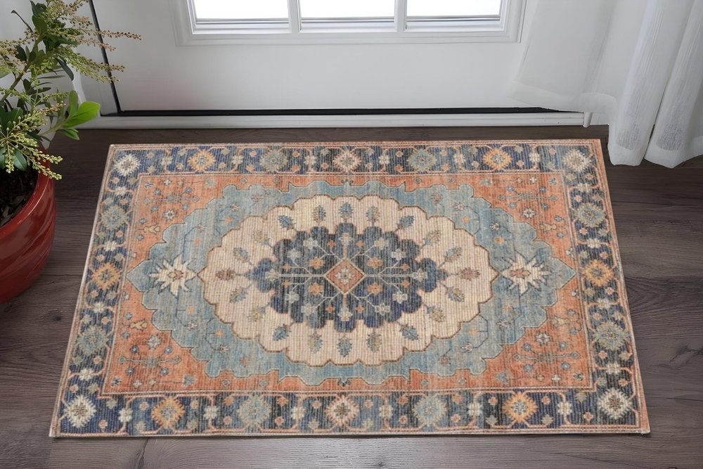 5' X 7' Blue Orange And Black Jute Medallion Hand Woven Area Rug