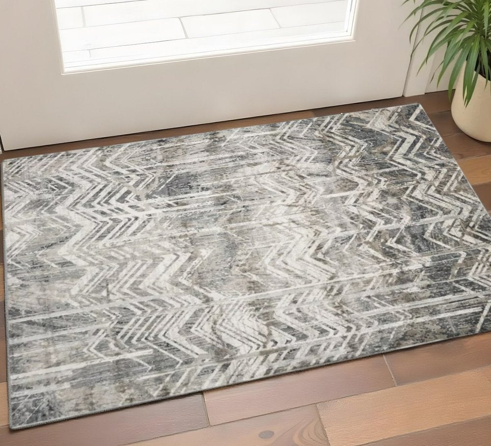 9' X 13' Dark Gray And Ivory Chevron Area Rug