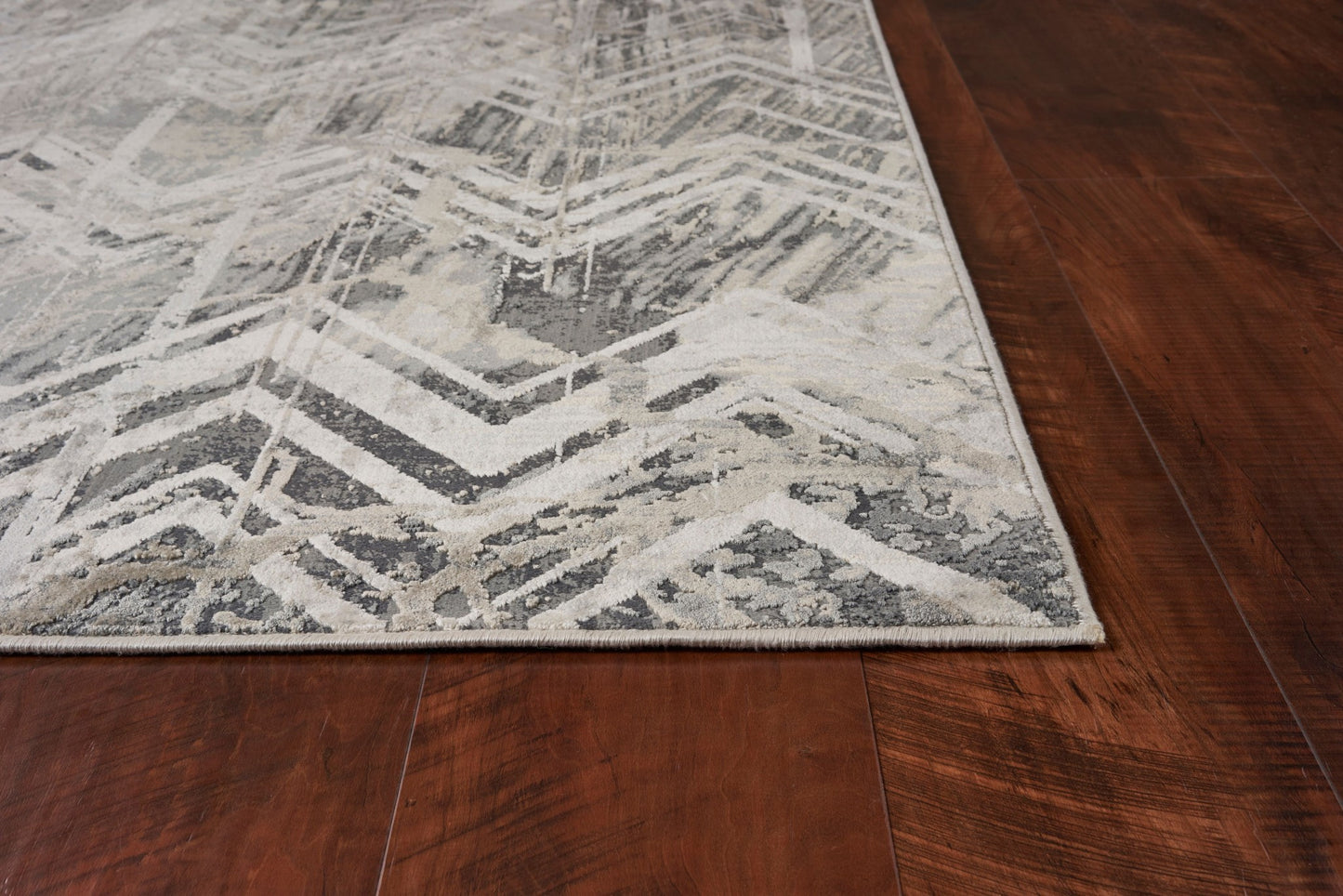 9' X 13' Dark Gray And Ivory Chevron Area Rug