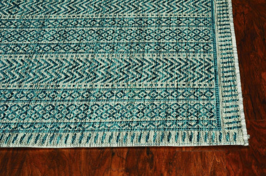 8' X 11' Teal And Beige Geometric Area Rug