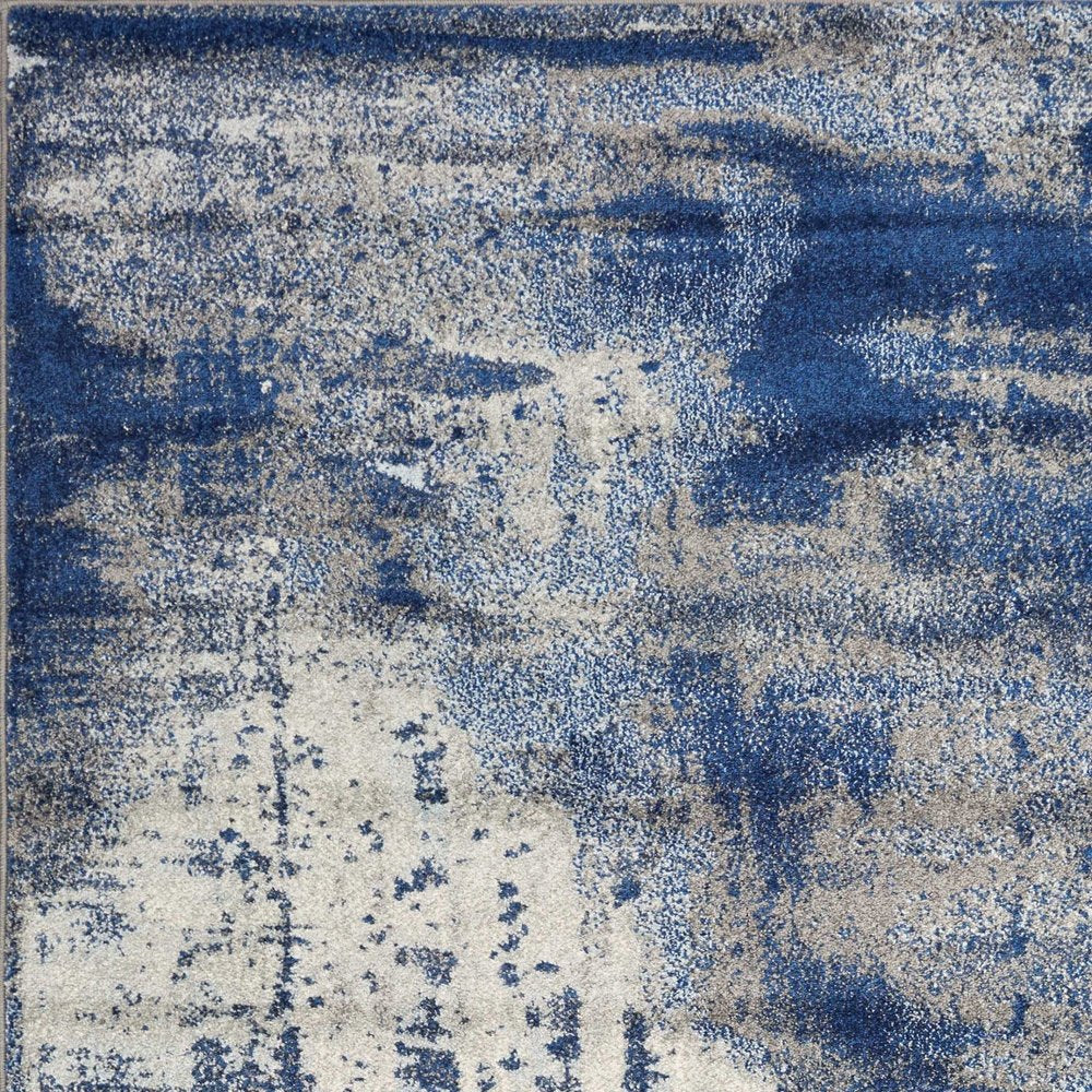 5' X 7' Blue Ivory And Gray Abstract Area Rug