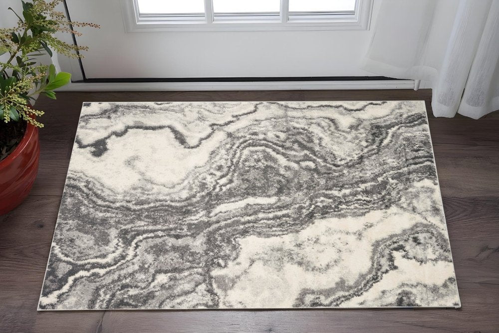 5' X 8' Gray And Ivory Abstract Area Rug