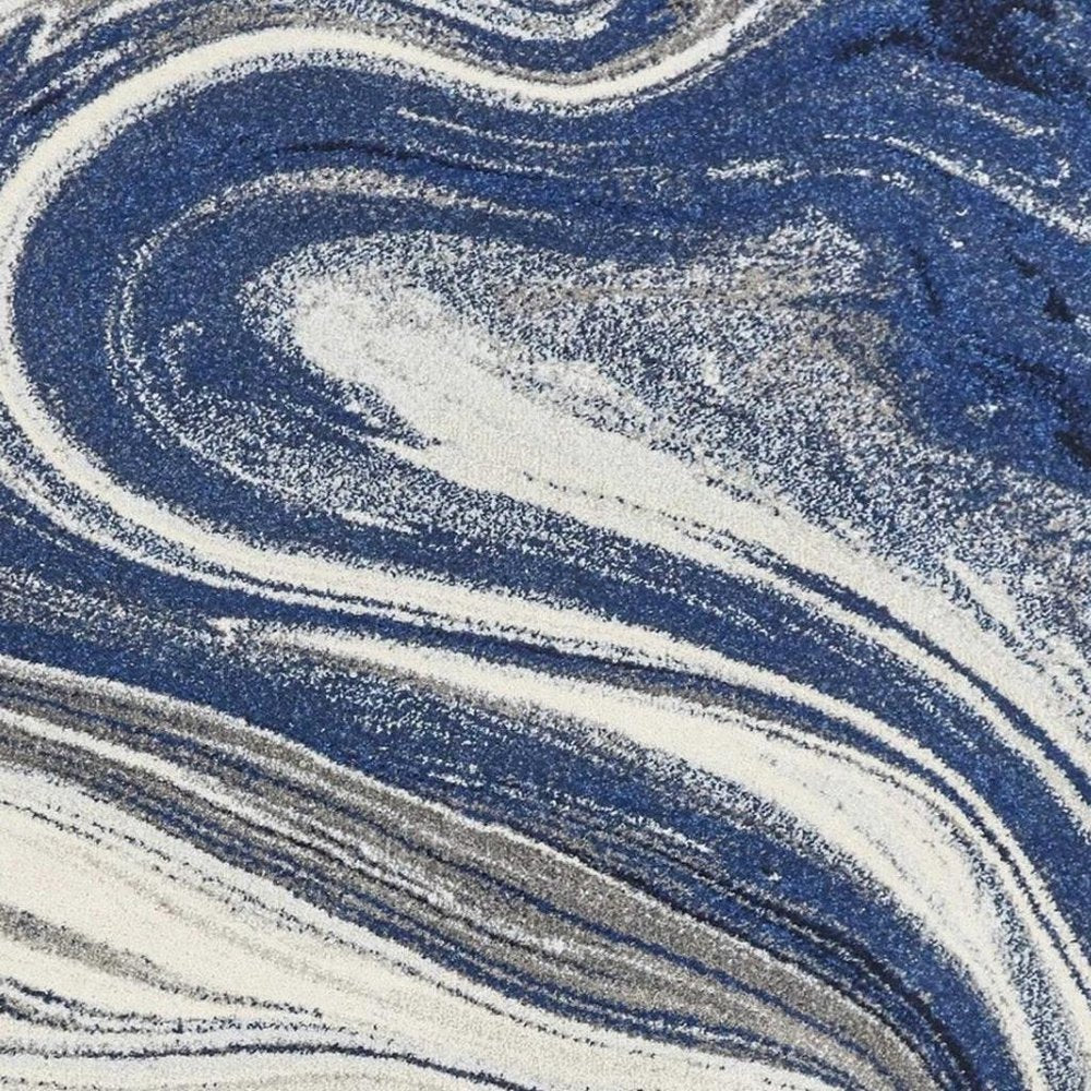 5' X 7' Blue And Beige Abstract Area Rug