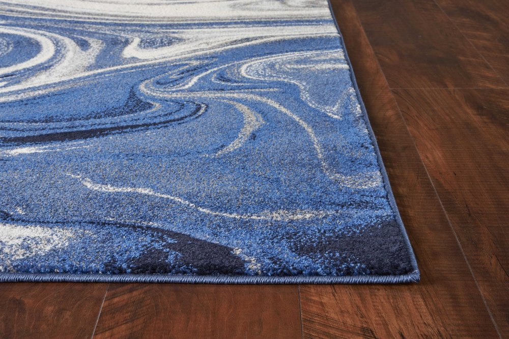 5' X 7' Blue And Beige Abstract Area Rug