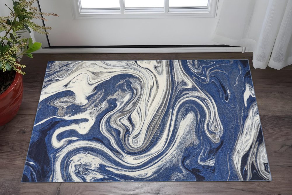 5' X 7' Blue And Beige Abstract Area Rug