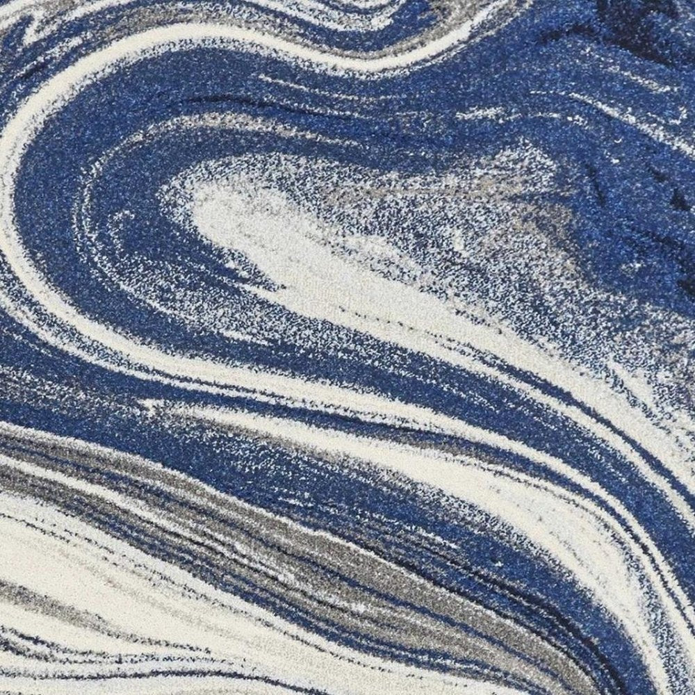 5' X 7' Blue And Beige Abstract Area Rug