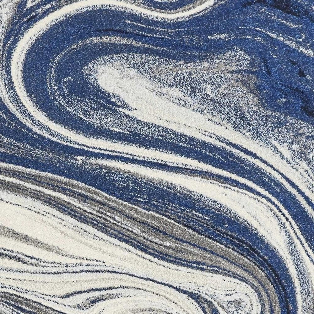 5' X 7' Blue And Beige Abstract Area Rug