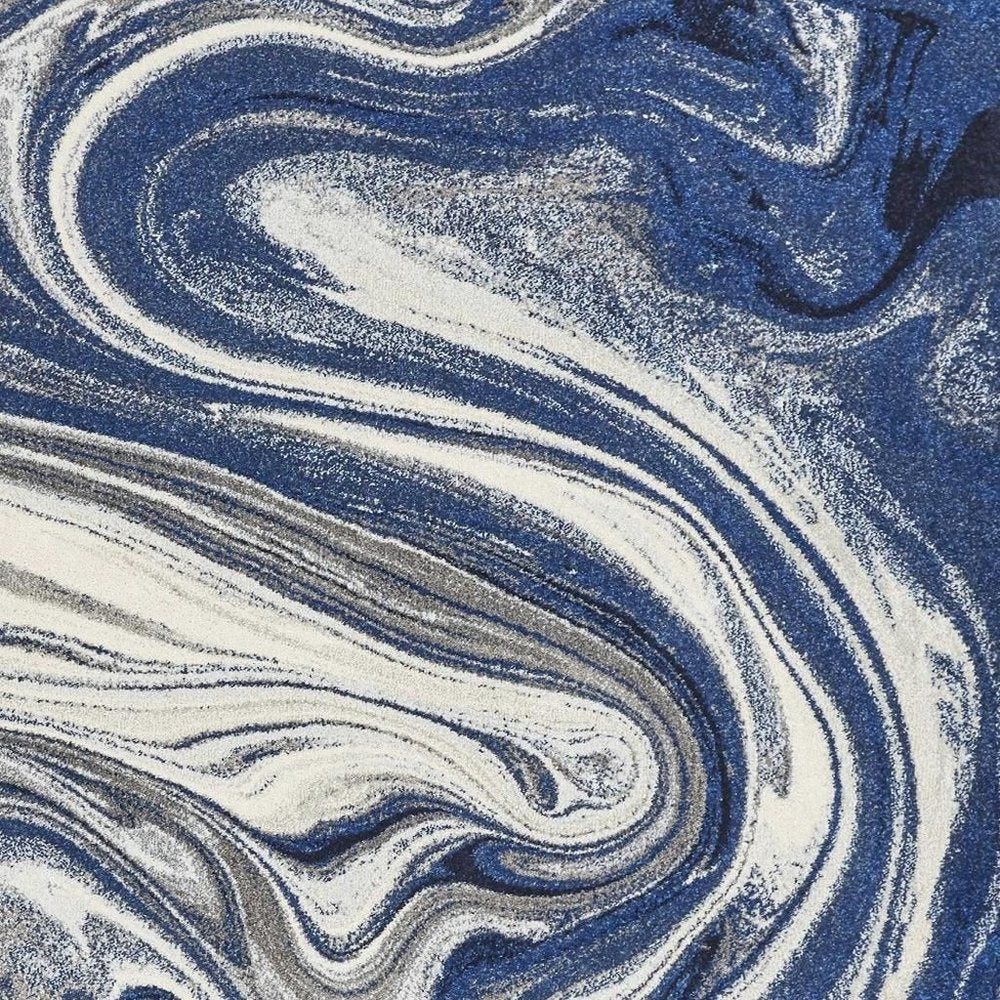 5' X 7' Blue And Beige Abstract Area Rug