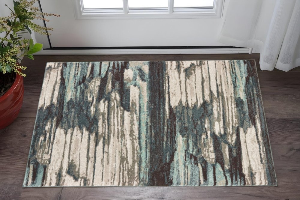 7' X 10' Ivory Blue And Gray Abstract Area Rug