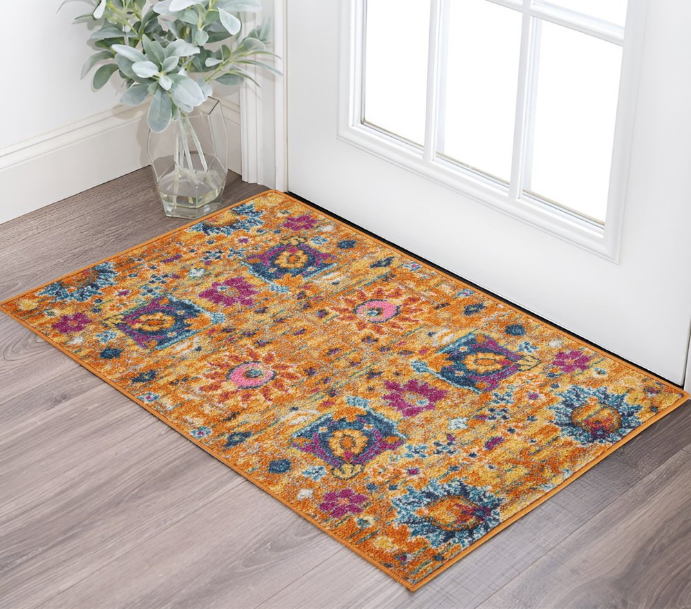 7' X 10' Blue And Orange Floral Distressed Area Rug
