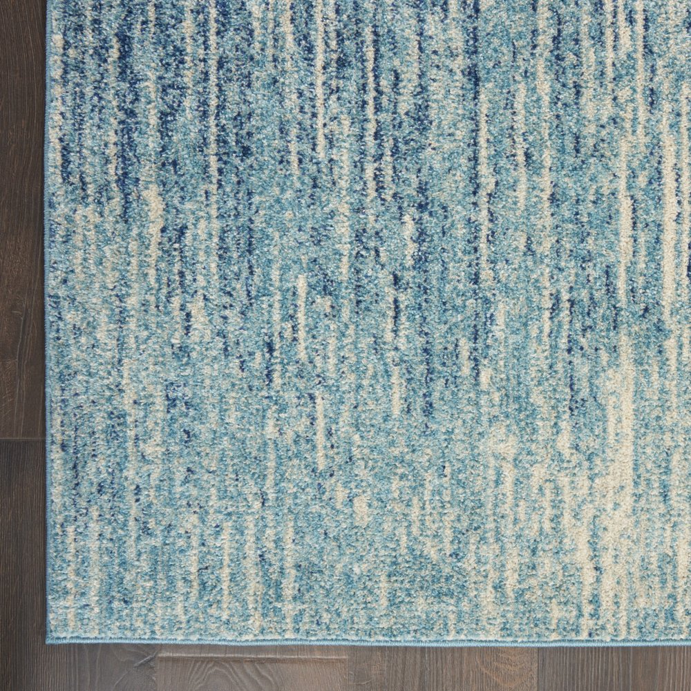 5' X 7' Blue And Ivory Abstract Area Rug