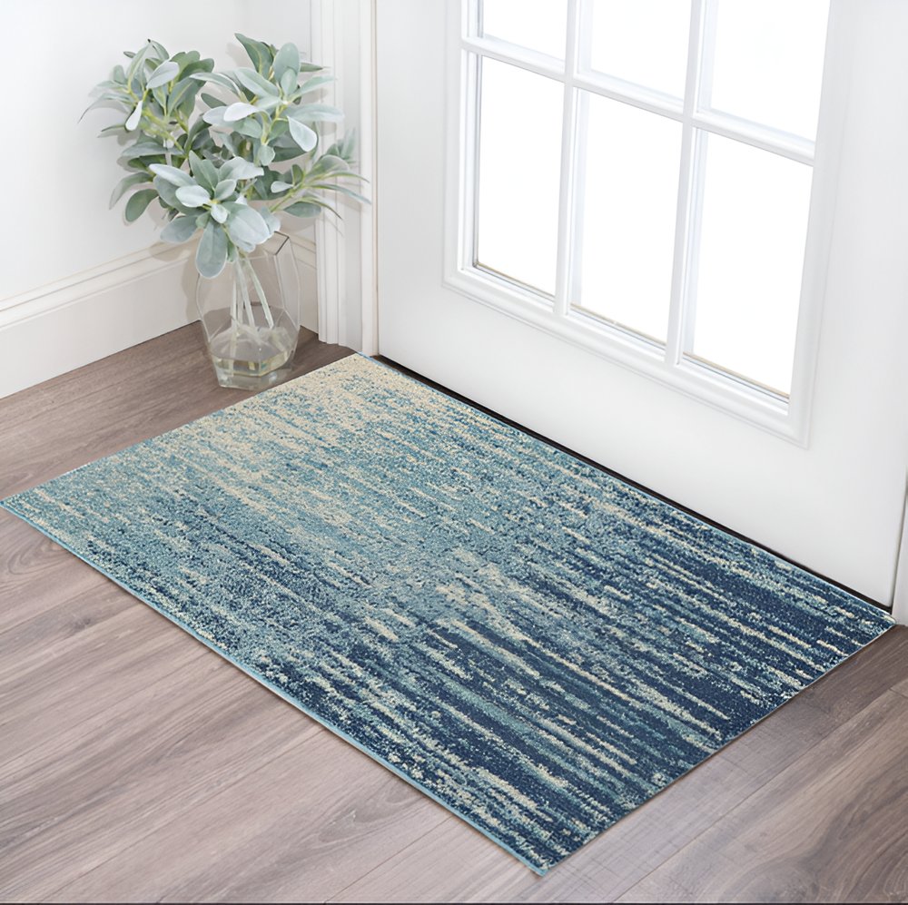 5' X 7' Blue And Ivory Abstract Area Rug