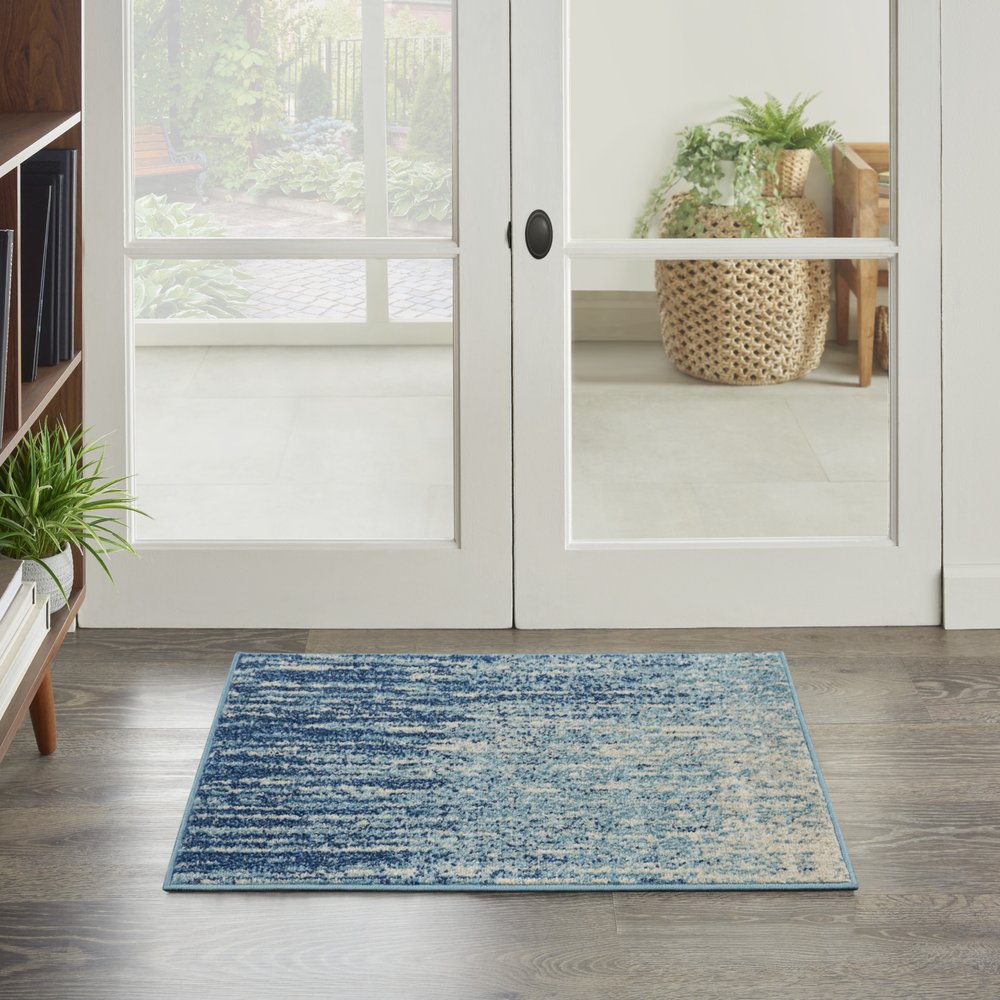 5' X 7' Blue And Ivory Abstract Area Rug